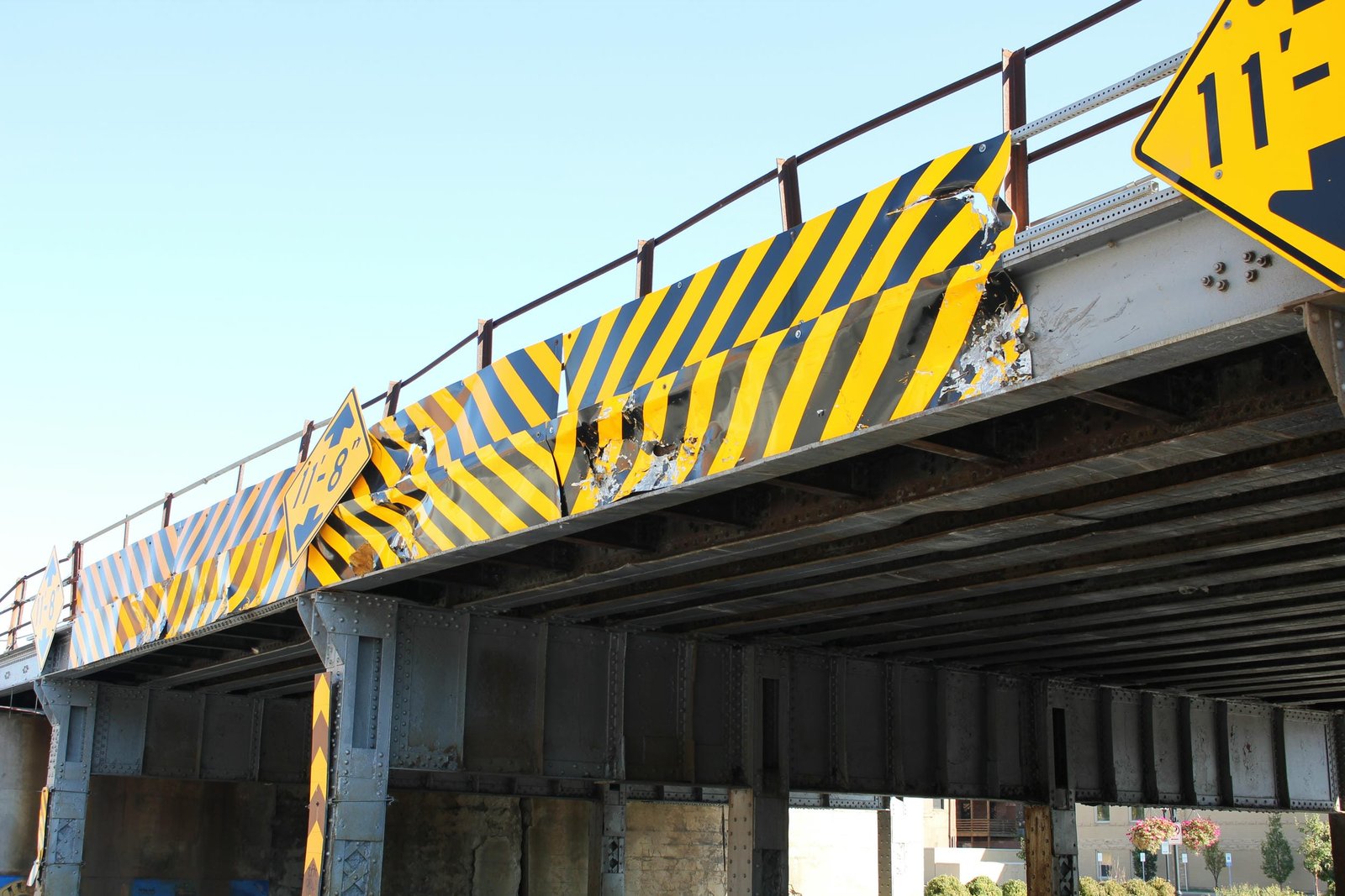 High visibility clearance sign with signs of recent strikes